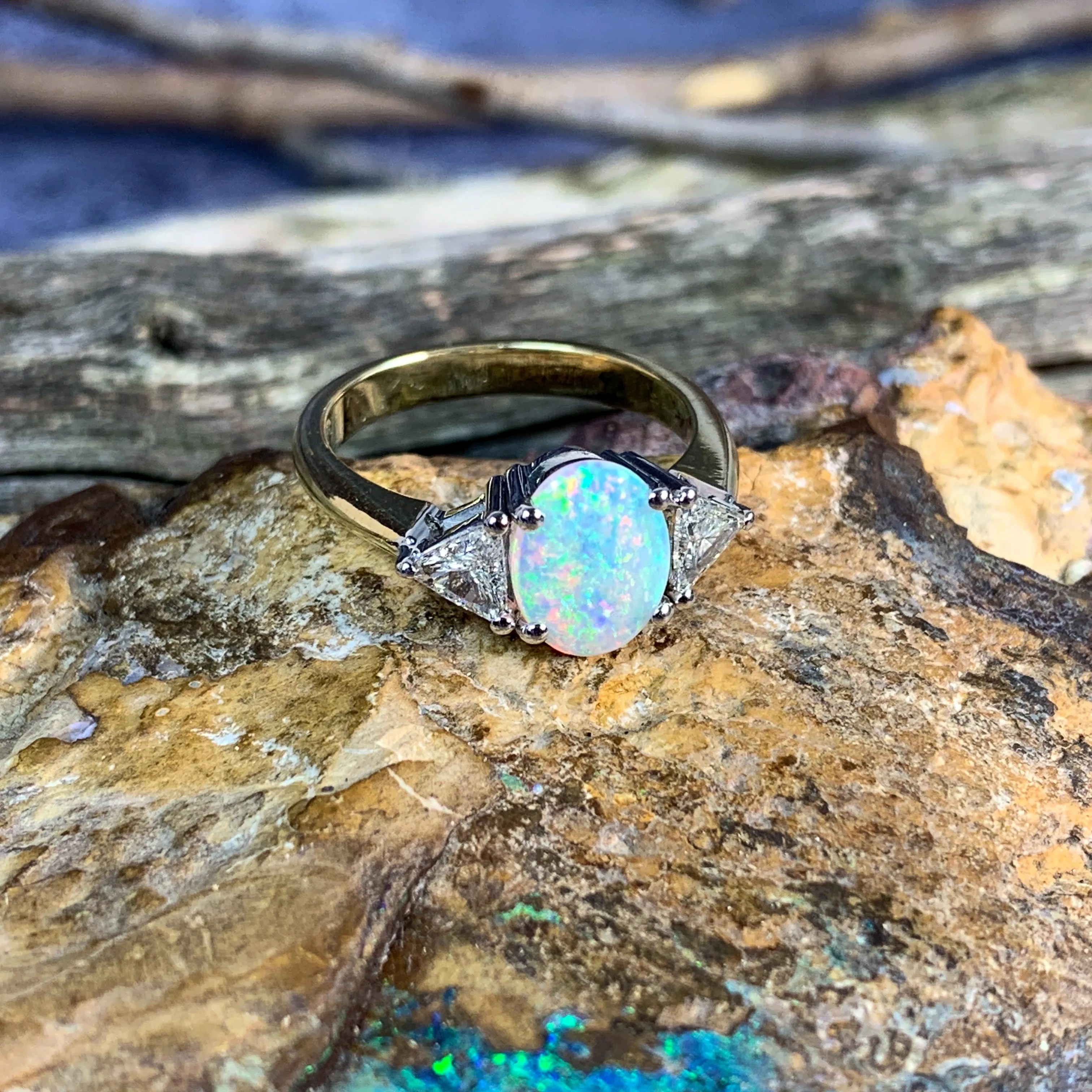 18kt Yellow and White Gold Crystal Opal 1.4ct amd trillion cut diamond ring