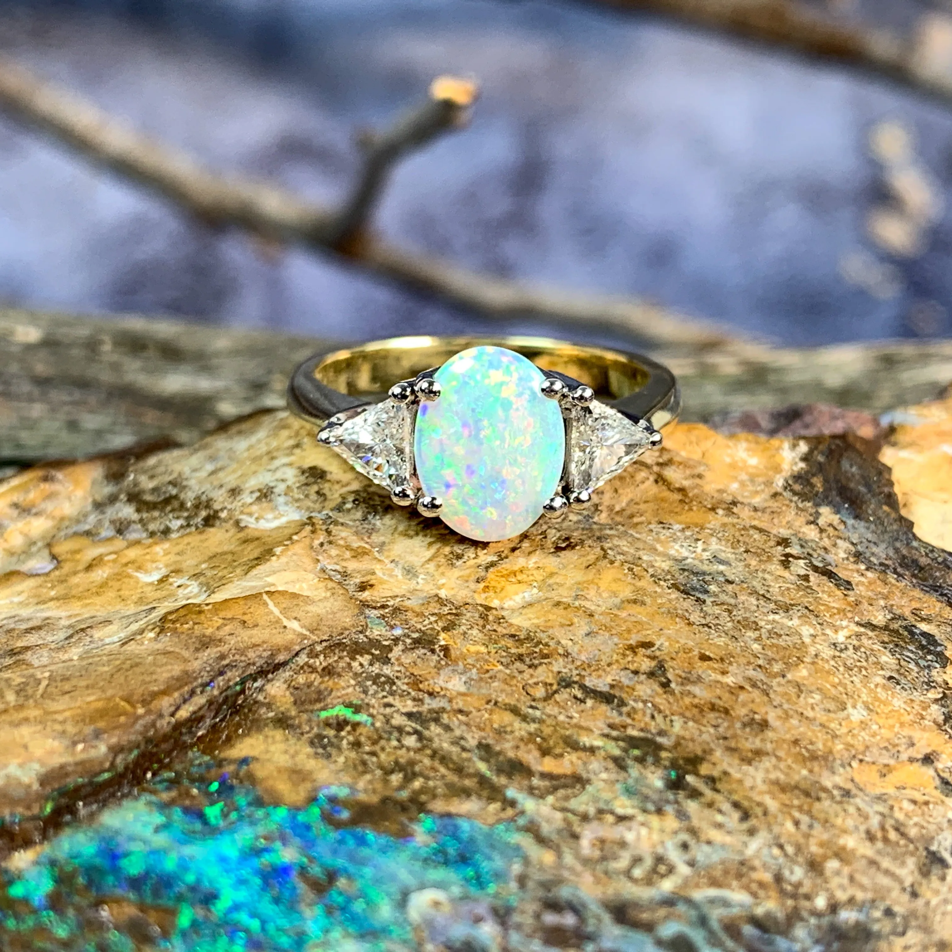 18kt Yellow and White Gold Crystal Opal 1.4ct amd trillion cut diamond ring