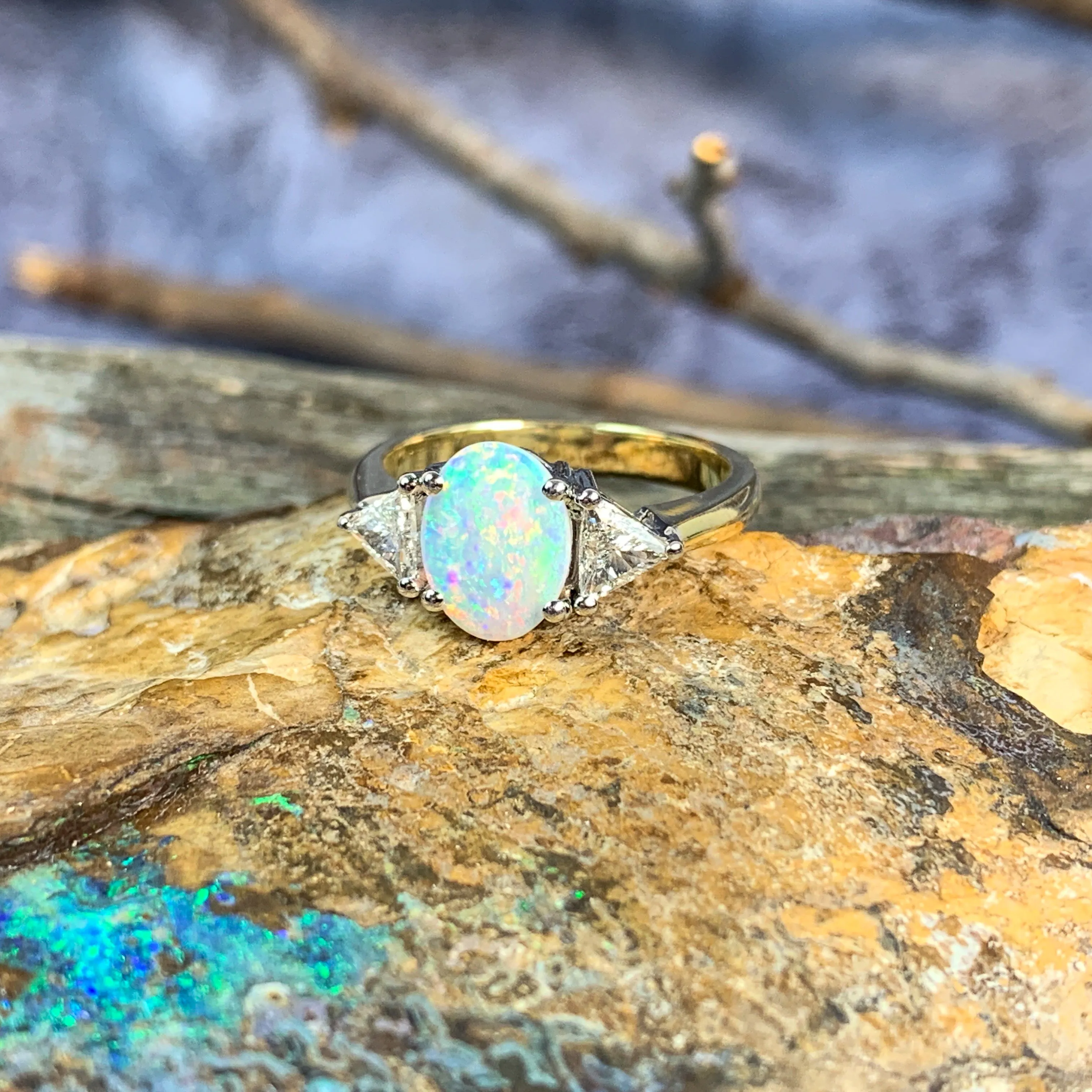 18kt Yellow and White Gold Crystal Opal 1.4ct amd trillion cut diamond ring